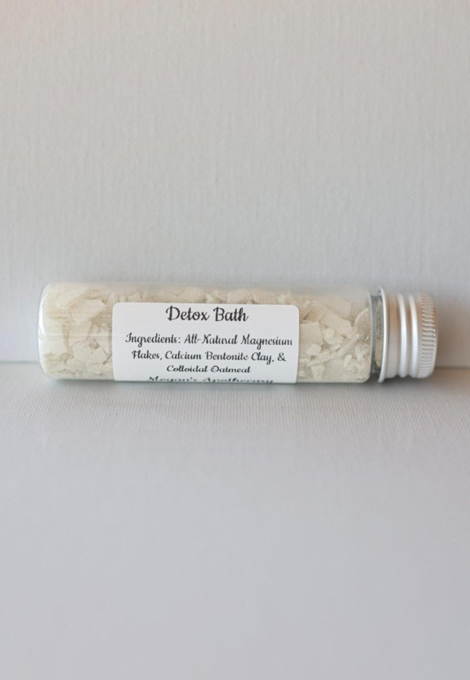 A tube of Detox Bath salts with the ingredients listed on the label